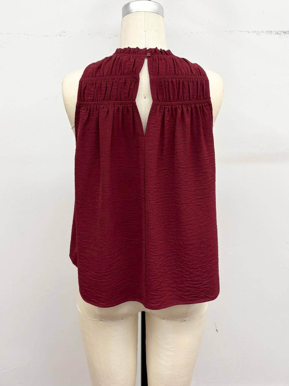 Smocked Mock Neck Sleeveless Blouse