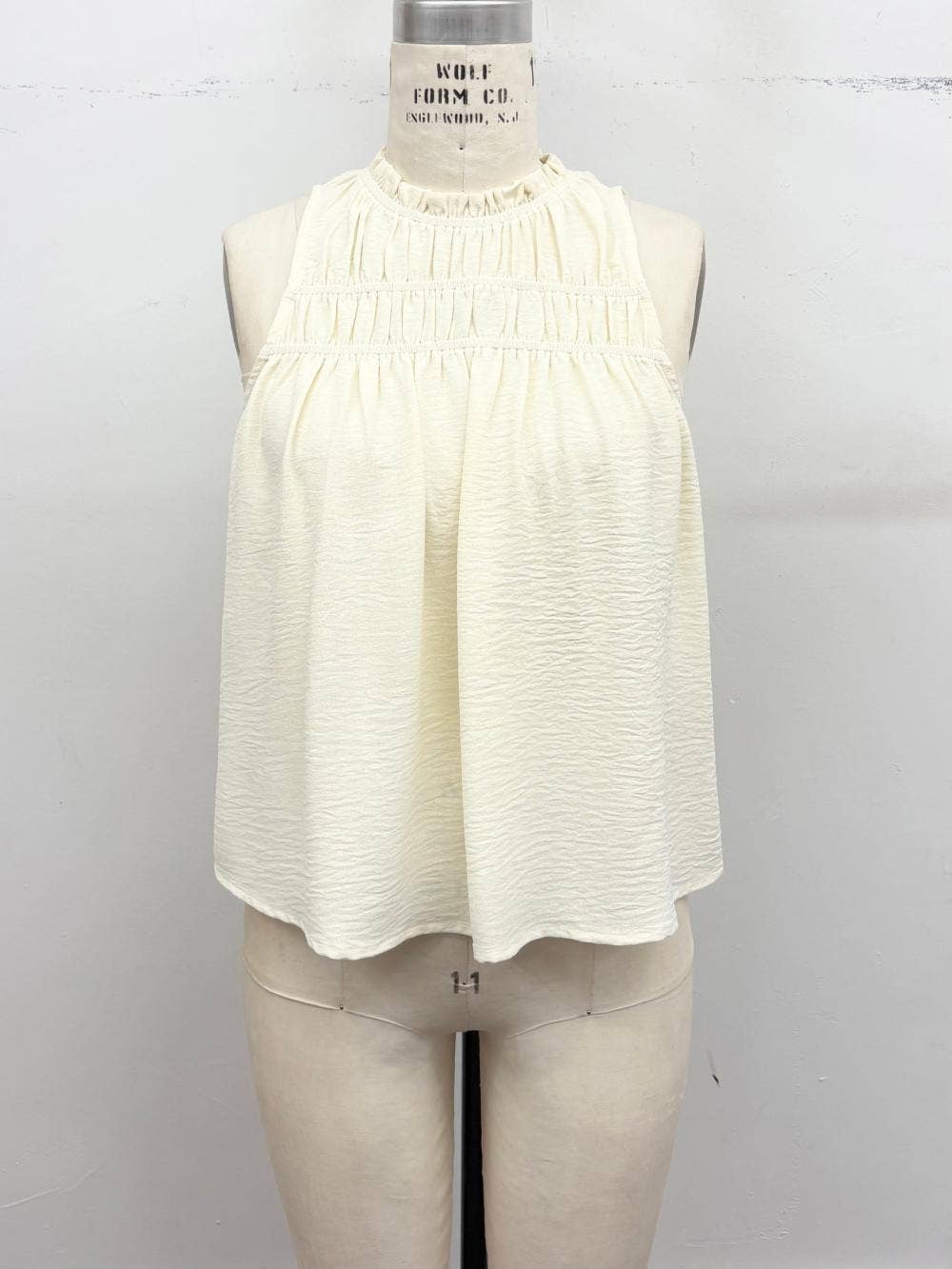 Smocked Mock Neck Sleeveless Blouse